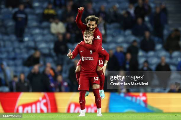 Harvey Elliott of Liverpool celebrates with teammate Mohamed Salah after scoring their team's seventh goal during the UEFA Champions League group A...