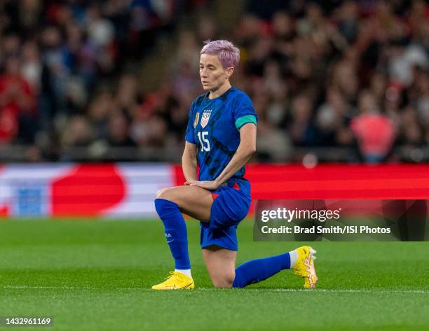 Megan Rapinoe of the United States kneels during a game between England and USWNT at Wembley Stadium on October 7, 2022 in London, England.