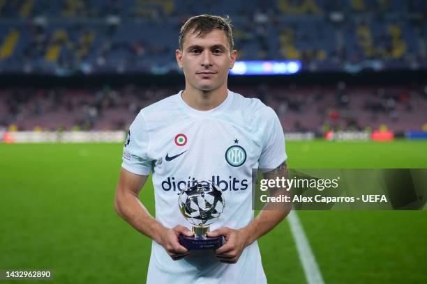 Nicolo Barella of FC Internazionale is presented with the PlayStation Player Of The Match Award after their sides victory during the UEFA Champions...