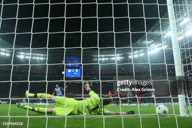 Mehdi Taremi of FC Porto scores their team's third goal from the penalty spot past Lukas Hradecky of Bayer Leverkusen during the UEFA Champions...