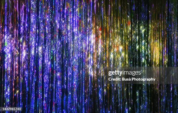 colorful tinsel glitter curtain - tinsel stock pictures, royalty-free photos & images