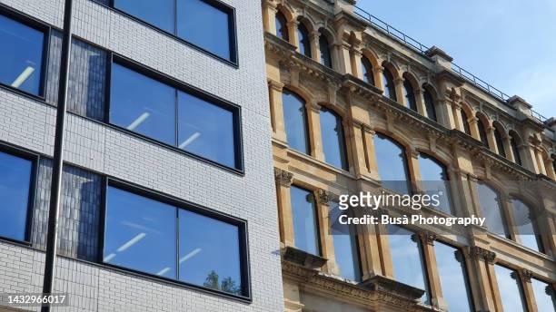contrast between old pre-war residential building and modern office building in london, england - with new era stock pictures, royalty-free photos & images