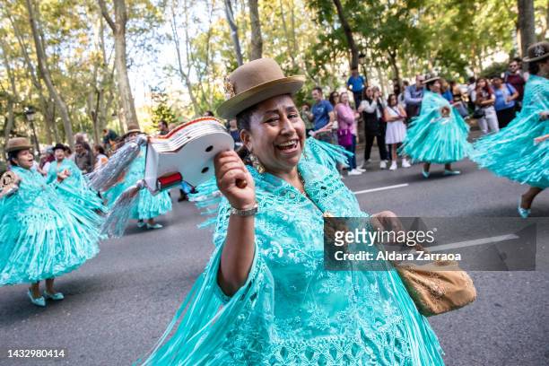 Women in traditional South American dress dance during the demonstration against Hispanic Day on October 12, 2022 in Madrid, Spain. Spain's National...