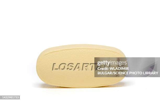 losartan pill, conceptual image - angiotensin stock pictures, royalty-free photos & images
