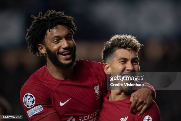 Roberto Firmino of Liverpool FC celebrates scoring their team's first goal with team mate Joe Gomez during the UEFA Champions League group A match...
