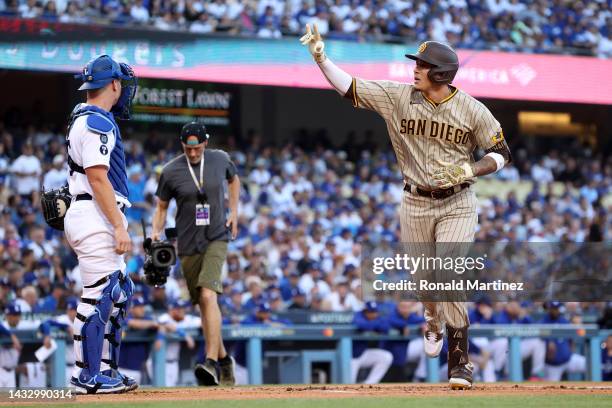 Manny Machado of the San Diego Padres celebrates his solo home run in the first inning during game two of the National League Division Series against...