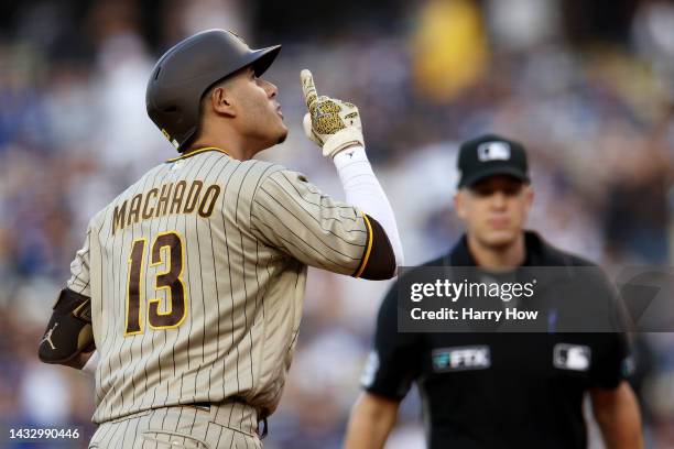 Manny Machado of the San Diego Padres celebrates his solo home run in the first inning during game two of the National League Division Series against...