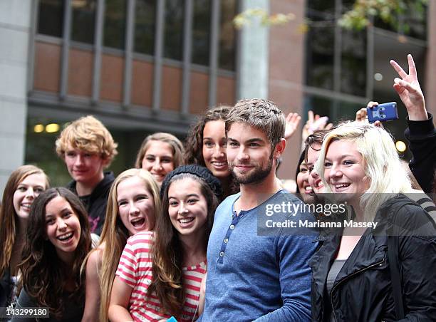 American actor, Chace Crawford poses for photos with fans at the Diet Coke pop-up photo set in Martin Place on April 23, 2012 in Sydney, Australia.