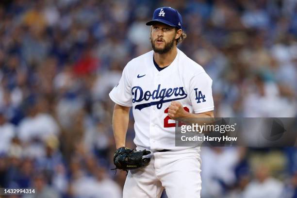Clayton Kershaw of the Los Angeles Dodgers reacts after striking out Austin Nola of the San Diego Padres to end of the top of the second inning...