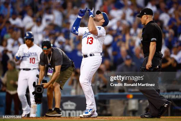 Max Muncy of the Los Angeles Dodgers celebrates his solo home run in the second inning in game two of the National League Division Series against the...