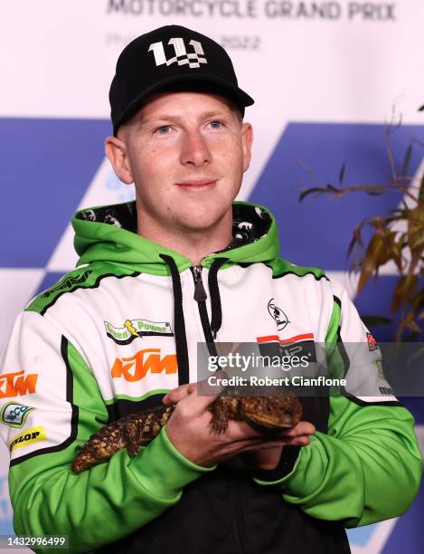 Joel Kelso of Australia and the CIP Green Power Honda team, poses with a Shingleback lizard during previews ahead of the MotoGP of Australia at...