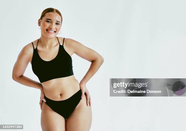 health, wellness and diet with happy, proud woman start her weight loss journey in a studio with mockup. portrait, exercise and plus size woman proud in underwear, ready to change and feel confident - voluptueus stockfoto's en -beelden