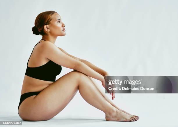 beauty, body and model with a plus size woman in underwear on a gray background with mockup in studio to promote health and wellness. healthy, normal and natural with an overweight or real female - authentic real stockfoto's en -beelden