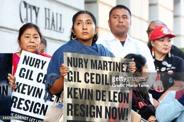 Protestors demonstrate outside City Hall calling for the resignations of L.A. City Council members Kevin de Leon and Gil Cedillo in the wake of a...