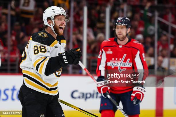 David Pastrnak of the Boston Bruins celebrates after recording an assist on a goal against the Washington Capitals during the third period of the...
