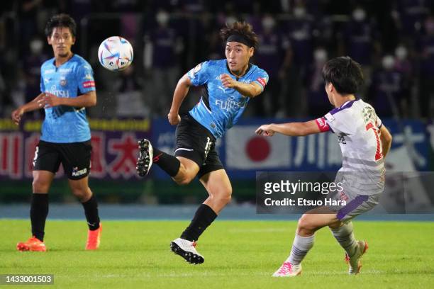 Daiya Tono of Kawasaki Frontale in action under pressure from Sota Kawasaki of Kyoto Sanga during the J.LEAGUE Meiji Yasuda J1 25th Sec. Match...