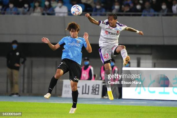 Shintaro Kurumaya of Kawasaki Frontale and Paulinho of Kyoto Sanga compete for ball during the J.LEAGUE Meiji Yasuda J1 25th Sec. Match between...