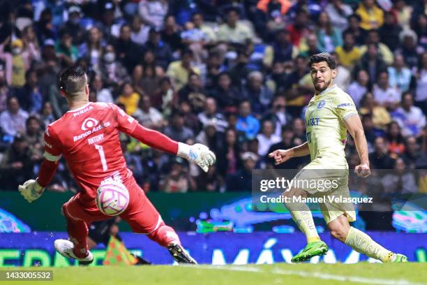 Antony Silva of Puebla battles for the ball against Henry Martín of America during the quarterfinals first leg match between Puebla and America as...