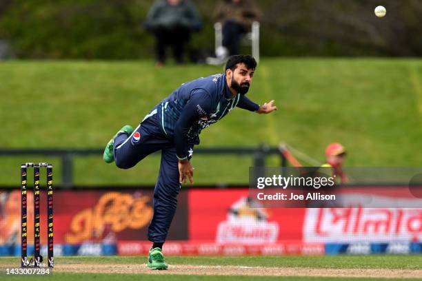 Shadab Khan of Pakistan bowls during game six of the T20 International series between Bangladesh and Pakistan at Hagley Oval on October 13, 2022 in...