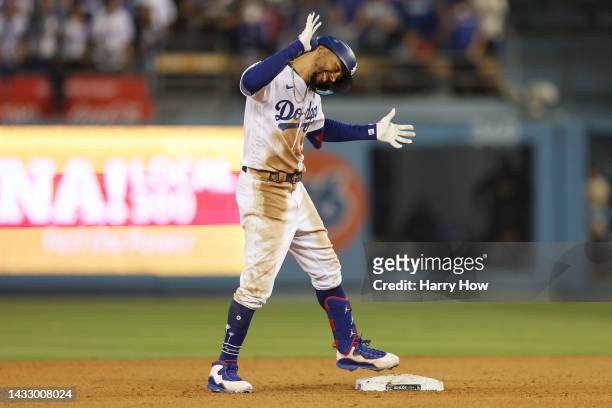 Mookie Betts of the Los Angeles Dodgers celebrates a double in the seventh inning in game two of the National League Division Series against the San...