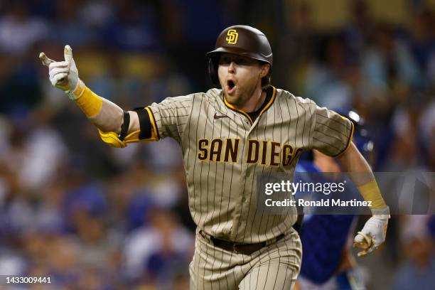 Jake Cronenworth of the San Diego Padres celebrates his solo home run in the eighth inning during game two of the National League Division Series...