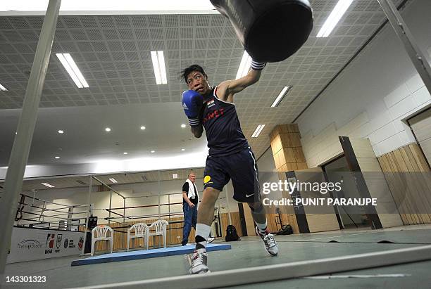 Indian woman boxer MC Mary Kom punches a bag during a training session at the Balewadi Sports Complex in Pune, about 180 km from Mumbai on April 20...