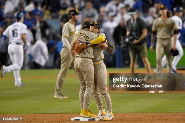 Ha-Seong Kim and Jake Cronenworth of the San Diego Padres celebrate a 5-3 win over the Los Angeles Dodgers in game two of the National League...