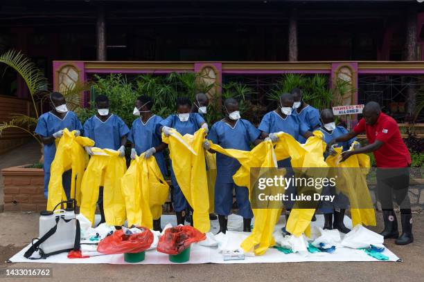 Volunteers receive training on how to conduct Safe and Dignified Burials of Ebola victims on October 12, 2022 in Mubende, Uganda. Emergency response...