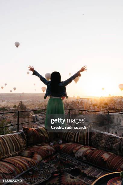 woman  is standing with hot balloon view - hot air balloon people stock pictures, royalty-free photos & images