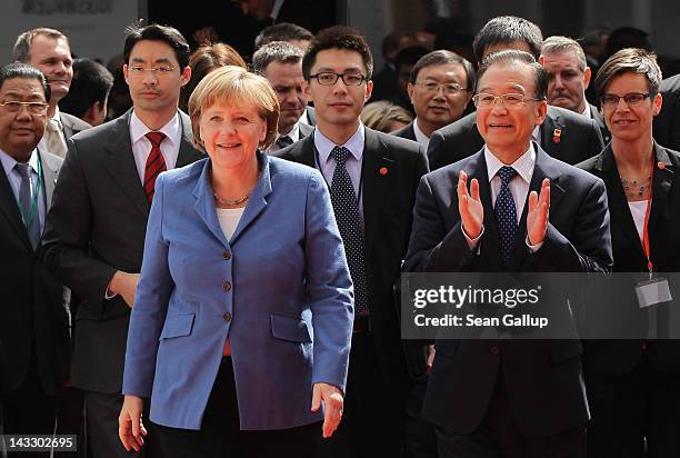 German Chancellor Angela Merkel and Chinese Premier Wen Jiabao arrive with German Vice Chancellor and Economy Minister Philipp Roesler at the...