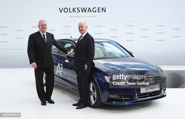 Volkswagen Chairman of the Supervisory Board Ferdinand Piech and Volkswagen CEO Martin Winterkorn stand next to an Audi A3 electric car while waiting...