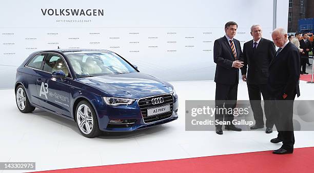 Lower Saxony Governor David McAllister, Volkswagen Chairman of the Supervisory Board Ferdinand Piech and Volkswagen CEO Martin Winterkorn chat while...