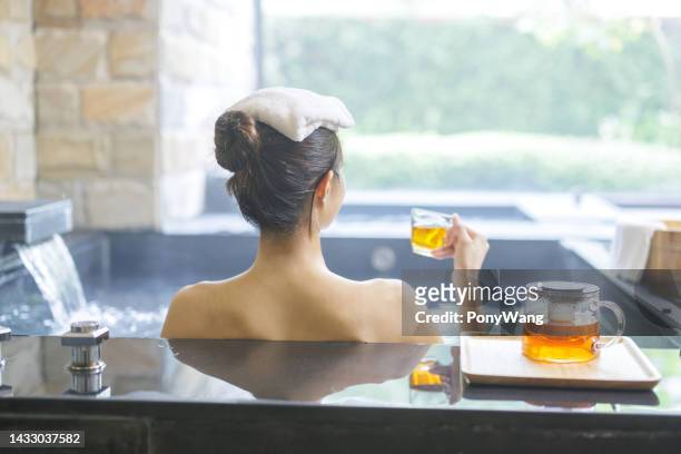 woman drink tea in water - boat in bath tub stock pictures, royalty-free photos & images