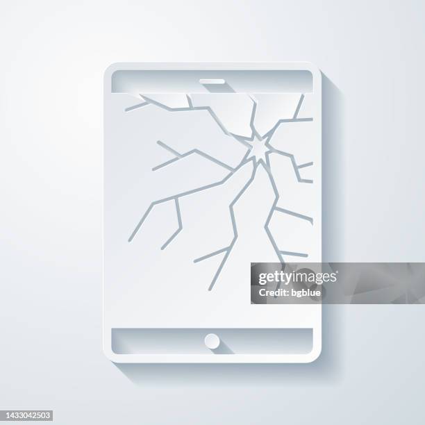 tablet pc with broken screen. icon with paper cut effect on blank background - broken tablet screen stock illustrations