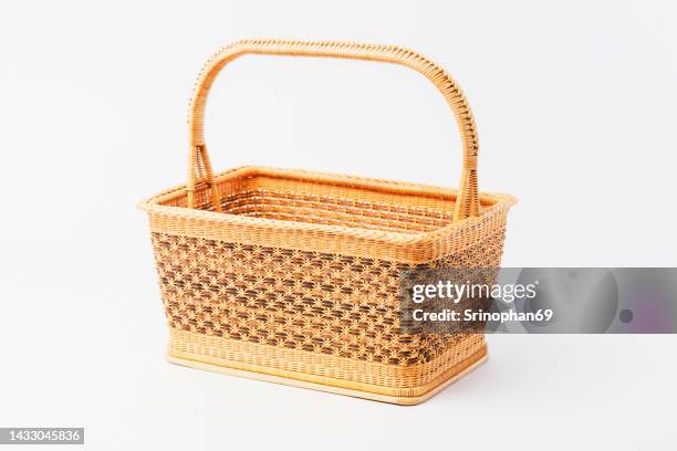 brown wicker basket on white background, handmade wicker basket - mimbre fotografías e imágenes de stock