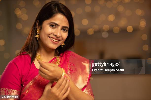 indian young woman diwali celebrate, stock photo - gold sari imagens e fotografias de stock