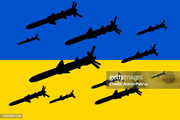 cruise missiles on the background of the ukrainian flag - cruise missile stockfoto's en -beelden