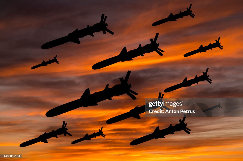 Cruise missiles against the sunset sky