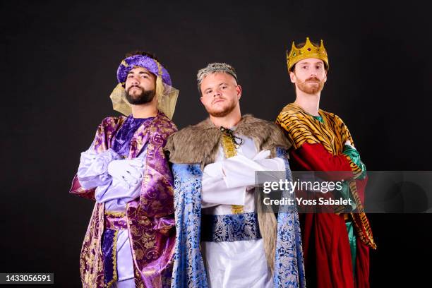 los tres reyes magos serious and with folded arms looking at the camera - los tres reyes magos stock-fotos und bilder