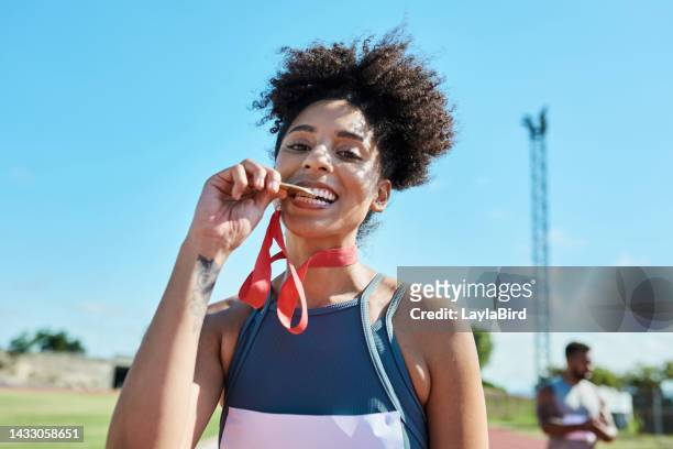 medal, winner and happy athlete celebration after winning race, competition or marathon on a track outdoor. black woman with achievement, award, and success with gold at a sports event or olympics - sportsperson medal stock pictures, royalty-free photos & images