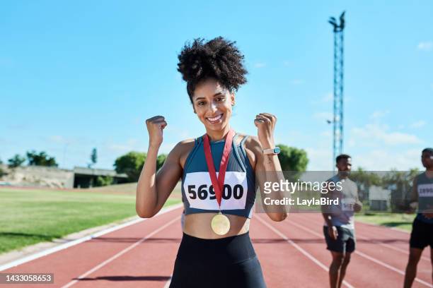 marathon portrait and success of woman winner at runner stadium track for champions in brazil. happy, excited and proud sports girl with smile and gold medal prize at running competition. - sportsperson medal stock pictures, royalty-free photos & images