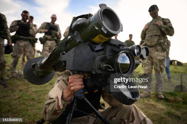 Ukrainian recruit looks through the viewfinder of a FGM-148 Javelin surface-to-air missile during a field training session with the UK armed forces...