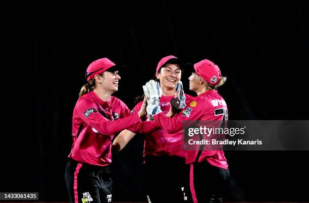 Angie Genford of the Sixers celebrates taking the catch to dismiss Georgia Redmayne of the Heat during the Women's Big Bash League match between the...