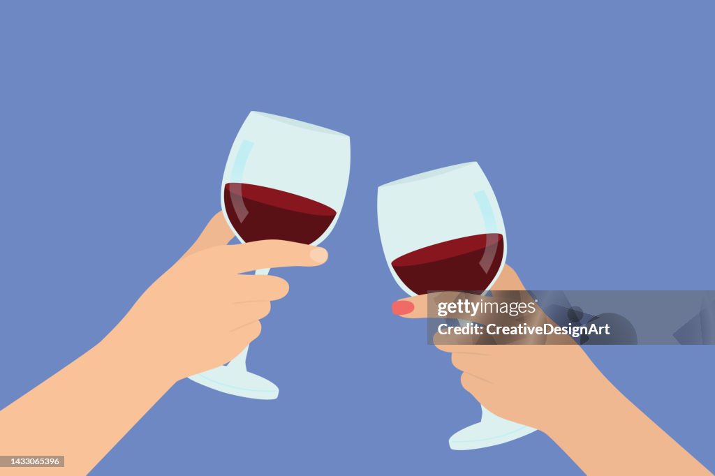 Close-up Of Couple Hands Toasting Wine Glasses