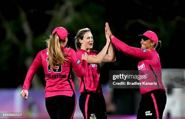 Ellyse Perry of the Sixers celebrates taking the wicket of Amelia Kerr of the Heat during the Women's Big Bash League match between the Brisbane Heat...