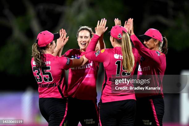 Ellyse Perry of the Sixers celebrates taking the wicket of Amelia Kerr of the Heat during the Women's Big Bash League match between the Brisbane Heat...