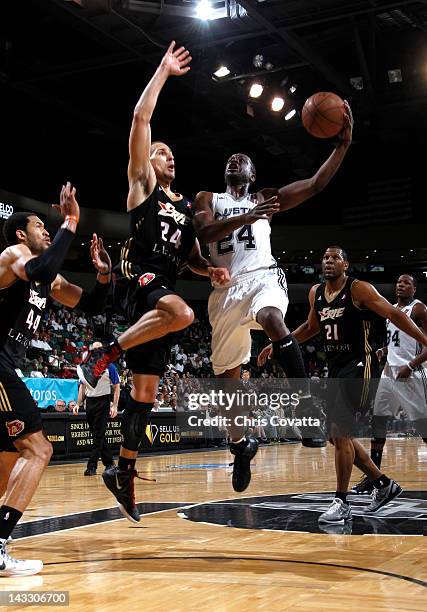 Flip Murray of the Austin Toros shoots over Mychel Thompson of the Erie BayHawks in game two of the NDBL Playoffs on April 15, 2012 at the Cedar Park...