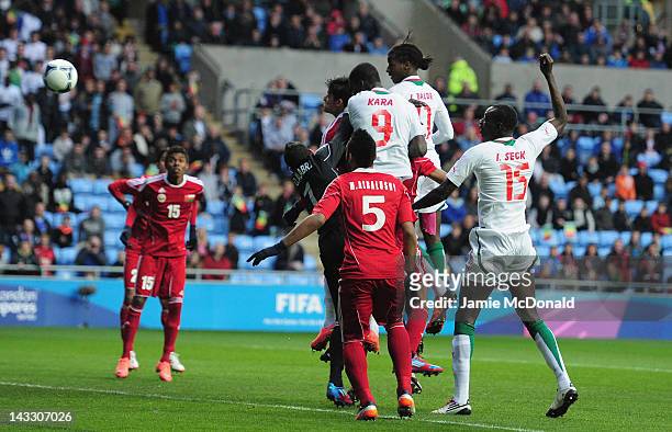 Ibrahima Balde of Senagal scores a goal during the London 2012 Olympic Qualifier between Senegal and Oman at Ricoh Arena on April 23, 2012 in...