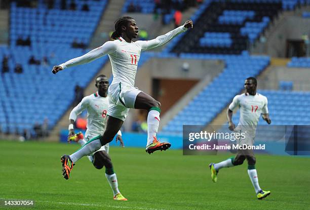 Ibrahima Balde of Senagal celebrates his goal during the London 2012 Olympic Qualifier between Senegal and Oman at Ricoh Arena on April 23, 2012 in...