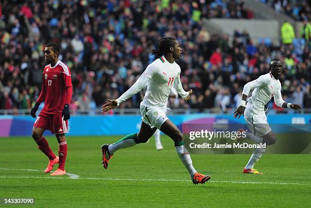 Ibrahima Balde of Senagal celebrates his goal during the London 2012 Olympic Qualifier between Senegal and Oman at Ricoh Arena on April 23, 2012 in...